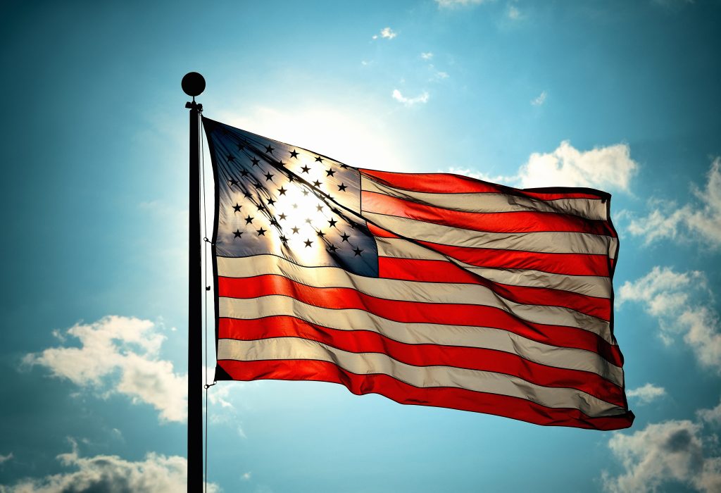United States National Flag flying in sky