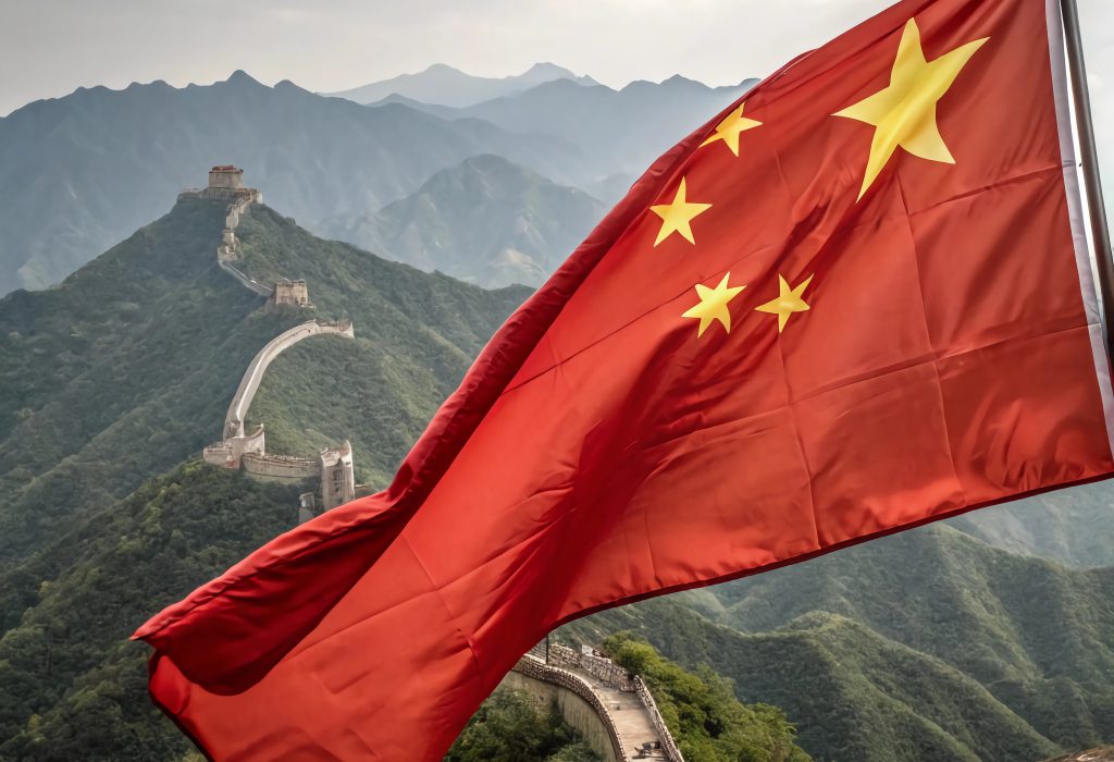 A close-up of the Chinese flag waving powerfully in the wind